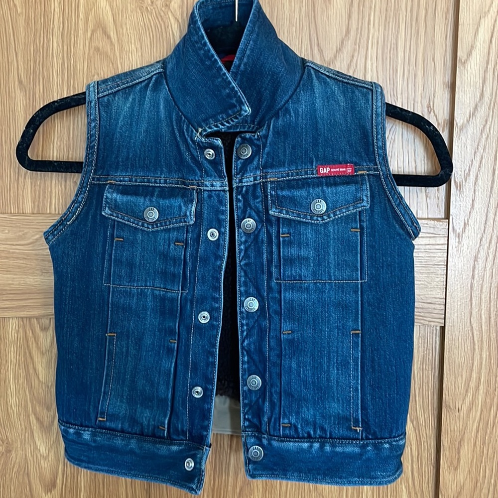 GAP. Adorable and thick jean vest! Inside has cozy teddy bear lining! Unisex